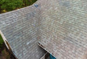 Roof with visible damage and wear, showcasing various marks and discoloration, emphasizing the need for professional roof inspections by Seneca Creek Home Improvement in Silver Spring, MD.